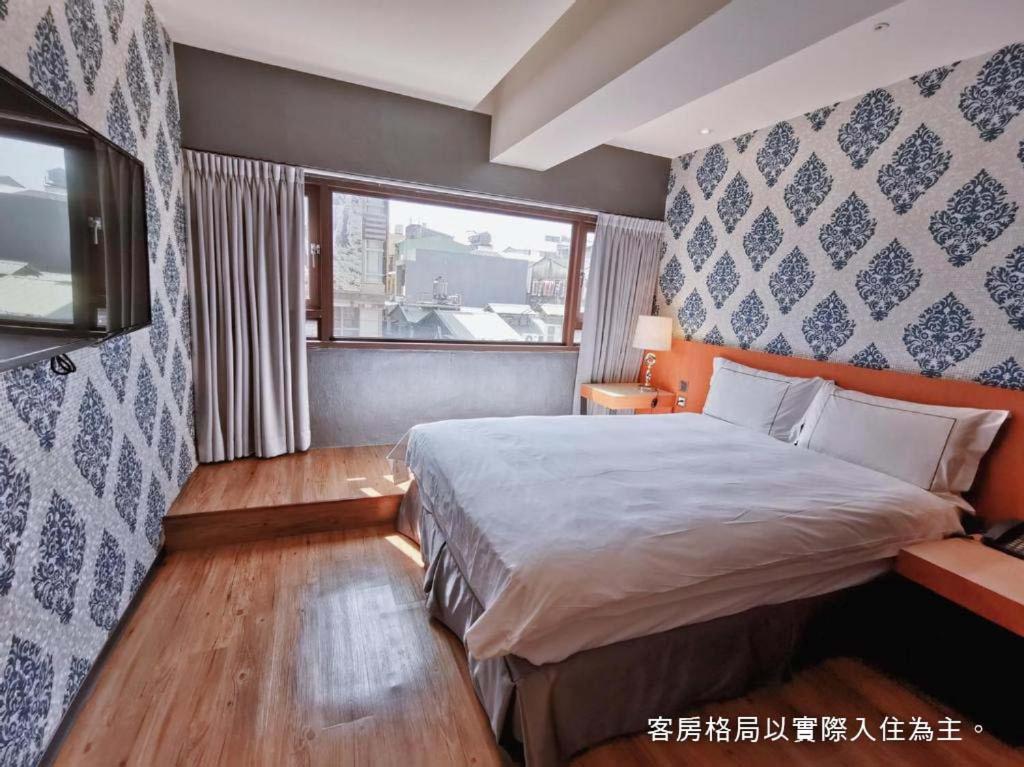 Postel nebo postele na pokoji v ubytování Talmud Hotel Yizhong