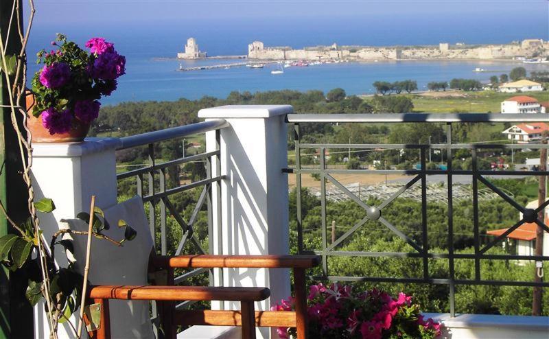 a balcony with a view of the water at Villa Tapia in Methoni