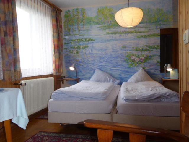 Postel nebo postele na pokoji v ubytování Hotel Hohe Flum