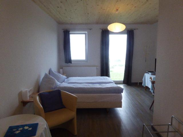 Postel nebo postele na pokoji v ubytování Hotel Hohe Flum