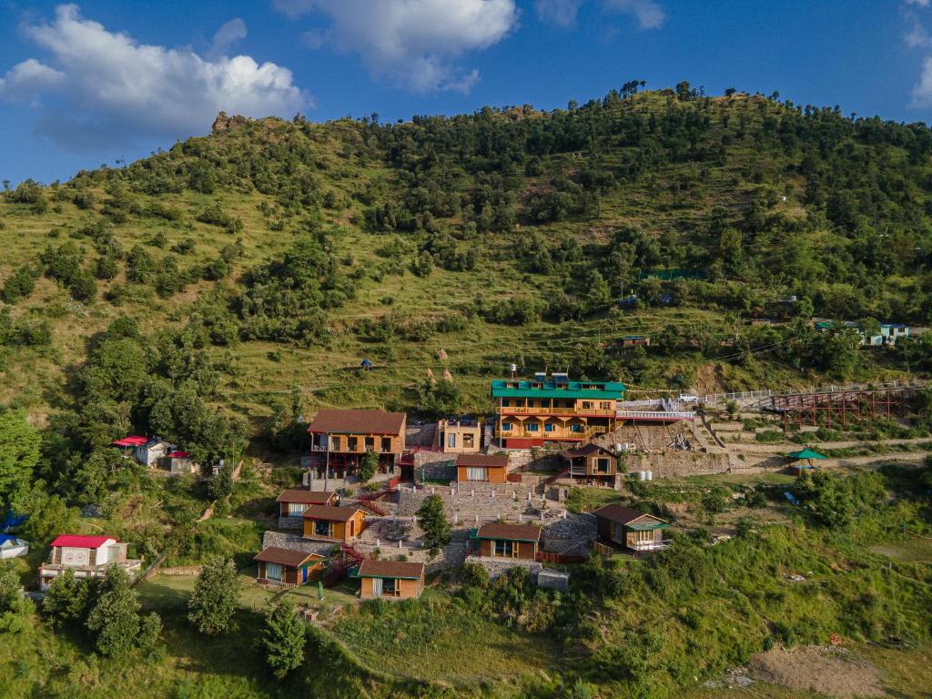 a village on the side of a hill at Seclude Pangot, Perch in Nainital