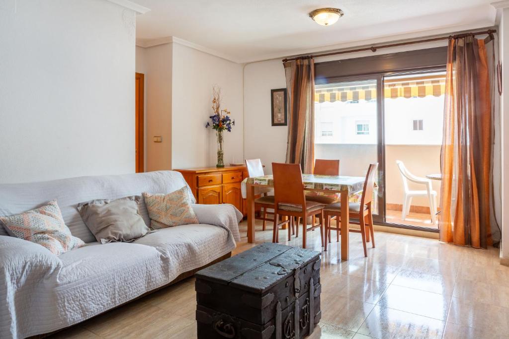 a living room with a couch and a table at Apolo66-3 in Torrevieja