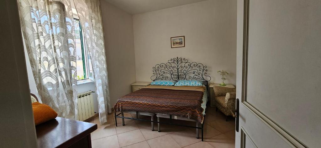 a bedroom with a bed in a room with a window at Casa Giusto Ischia in Ischia
