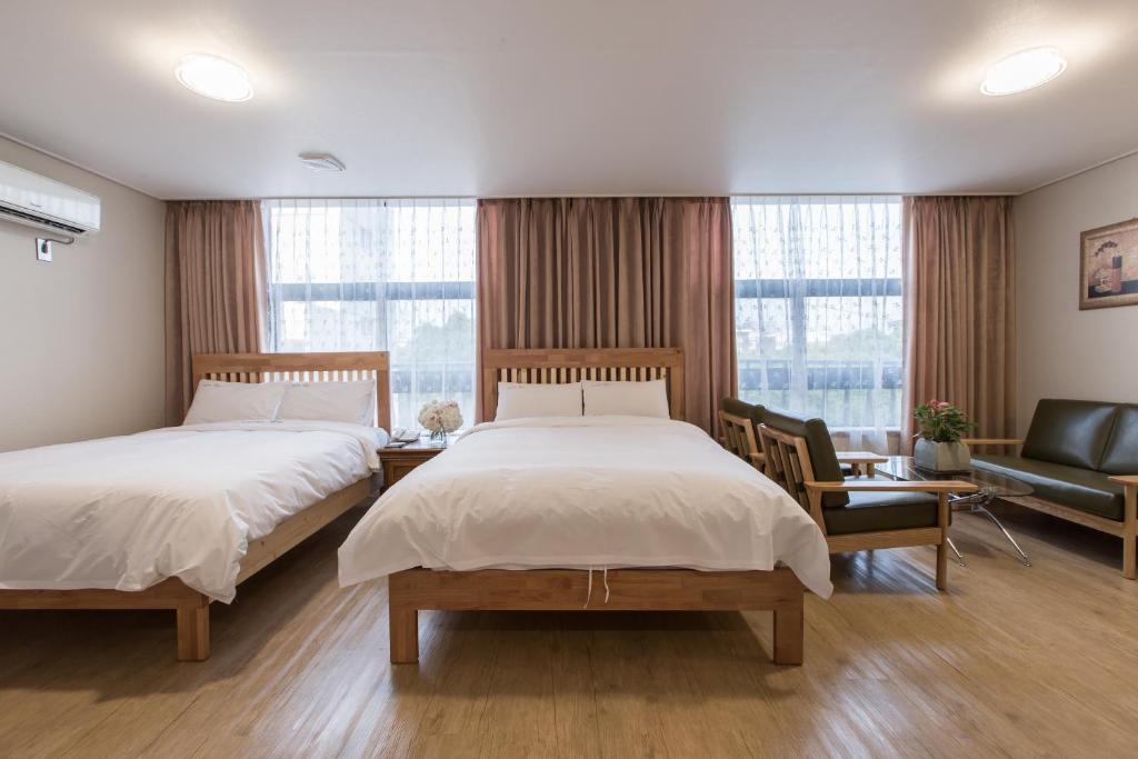 Postel nebo postele na pokoji v ubytování Elin Hotel