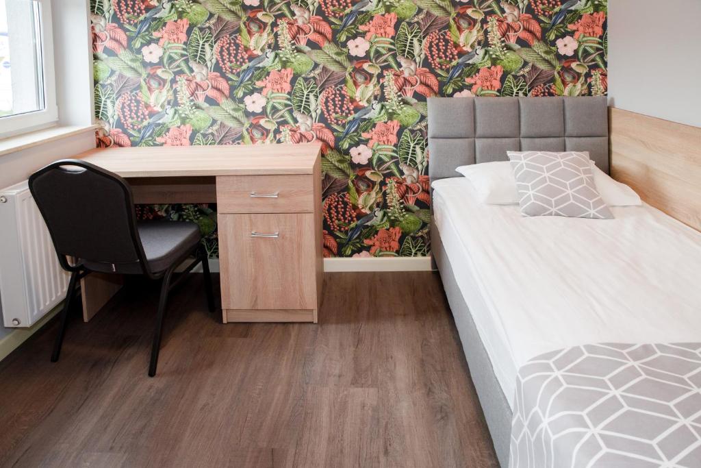 Postel nebo postele na pokoji v ubytování Hotel 107