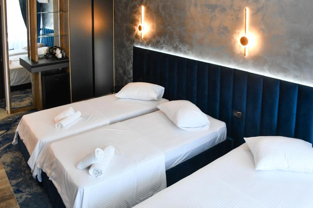 Postel nebo postele na pokoji v ubytování HOTEL TOPAZ 4* CAP AURORA