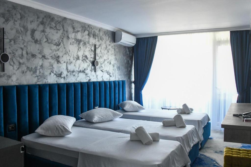 Postel nebo postele na pokoji v ubytování HOTEL TOPAZ 4* CAP AURORA