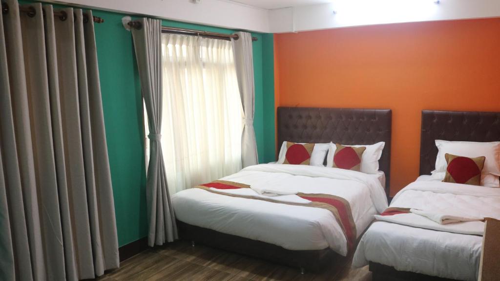 Postel nebo postele na pokoji v ubytování Nepalaya Home Hostel
