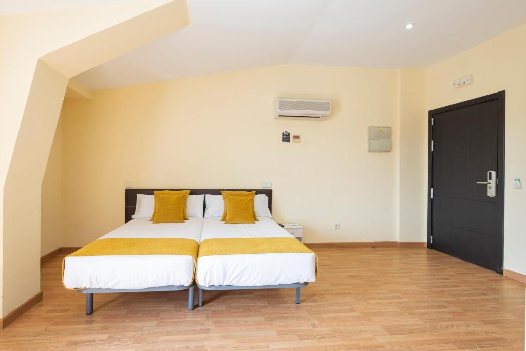 Postel nebo postele na pokoji v ubytování Hotel Alda Borox