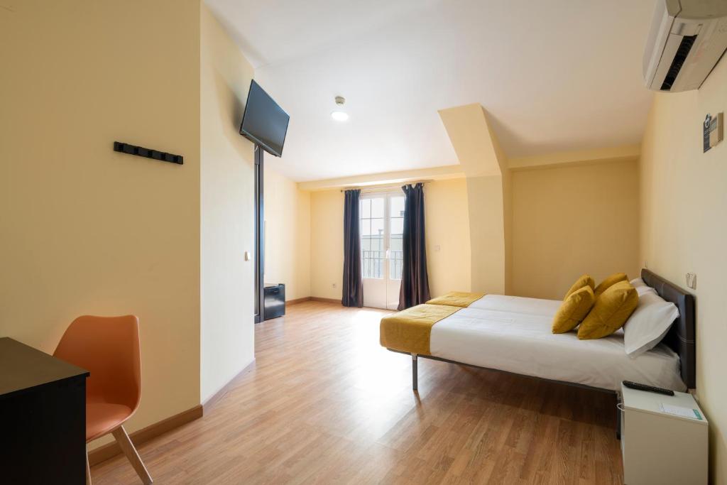 Postel nebo postele na pokoji v ubytování Hotel Alda Borox