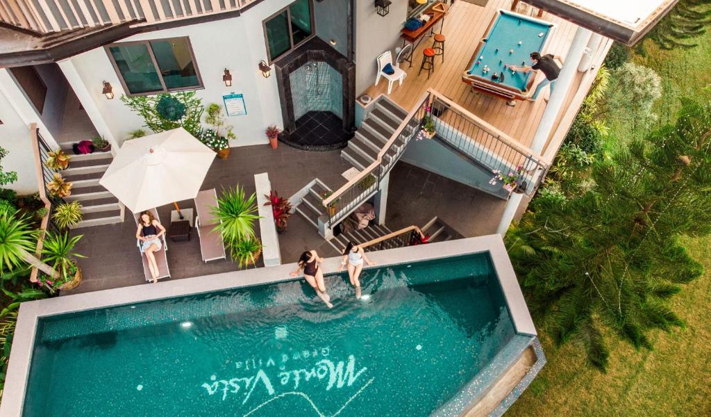 an aerial view of a house with a swimming pool at Monte Vista Chalet Khaoyai in Ban Nong Song Hong