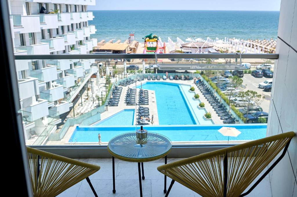 a view of a pool from the balcony of a hotel at Sea-esta Studio in Infinity Beach Resort in Mamaia