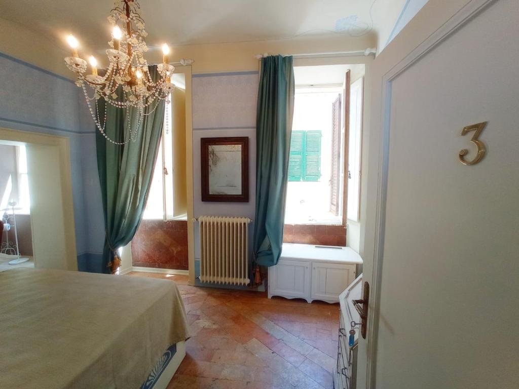 Postel nebo postele na pokoji v ubytování Hotel Oviv dimora del borgo