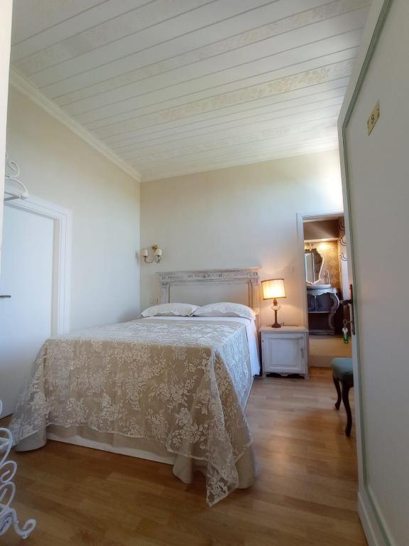 Postel nebo postele na pokoji v ubytování Hotel Oviv dimora del borgo