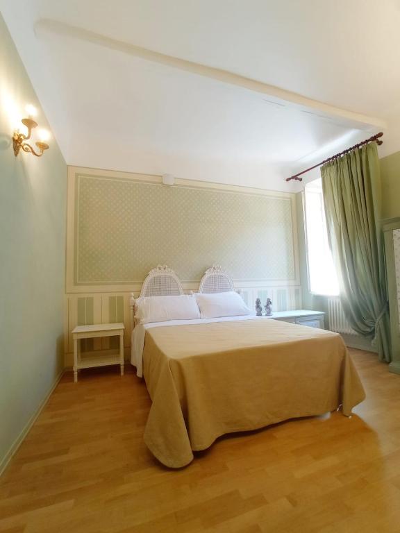 Postel nebo postele na pokoji v ubytování Hotel Oviv dimora del borgo