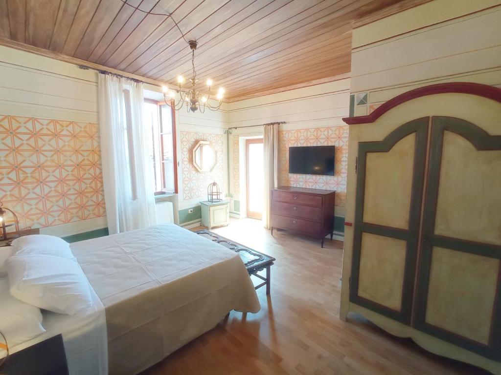Postel nebo postele na pokoji v ubytování Hotel Oviv dimora del borgo