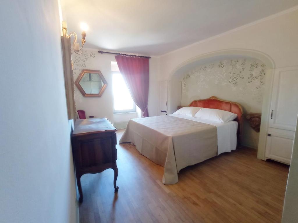 Postel nebo postele na pokoji v ubytování Hotel Oviv dimora del borgo
