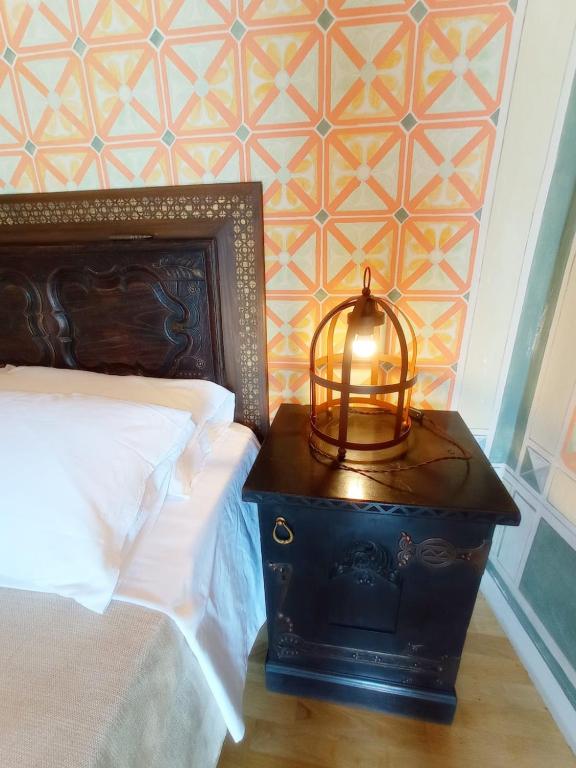 Postel nebo postele na pokoji v ubytování Hotel Oviv dimora del borgo