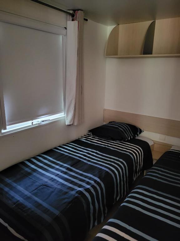 Postel nebo postele na pokoji v ubytování Camping Ixtila mobilhome Betzüla