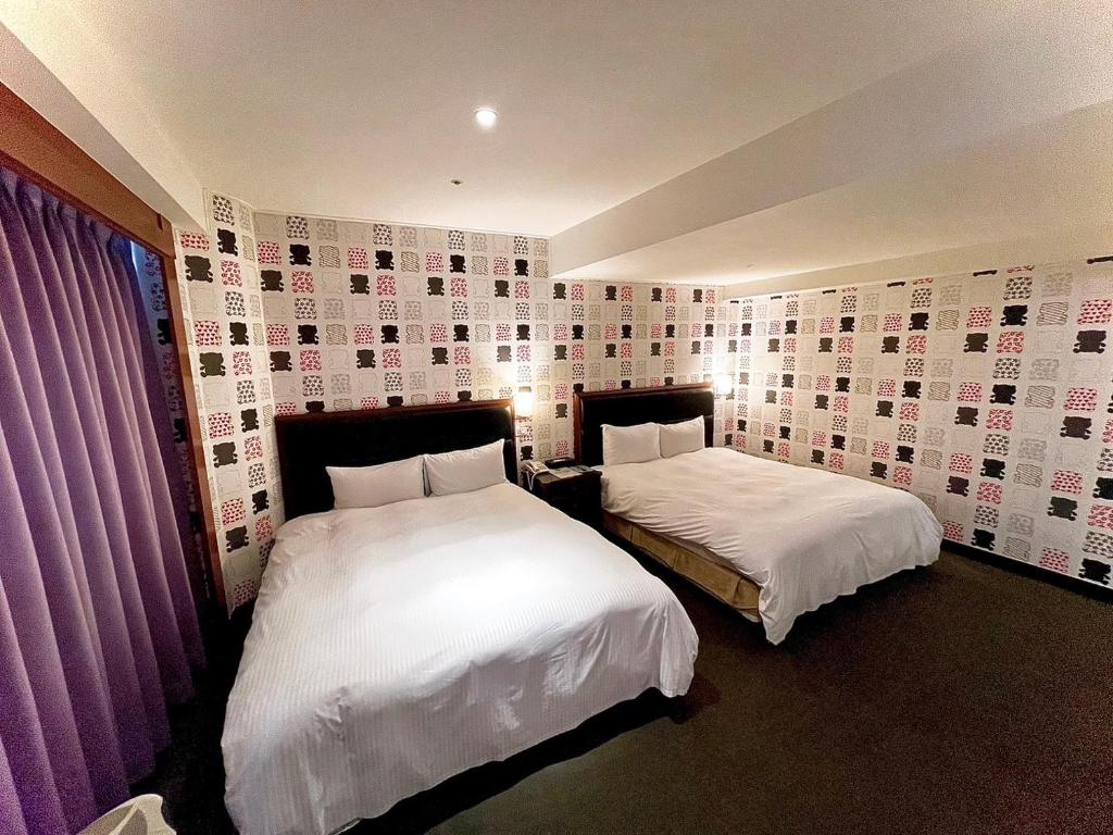 Postel nebo postele na pokoji v ubytování 喜客商旅 Seeker Hotel - Sanchong