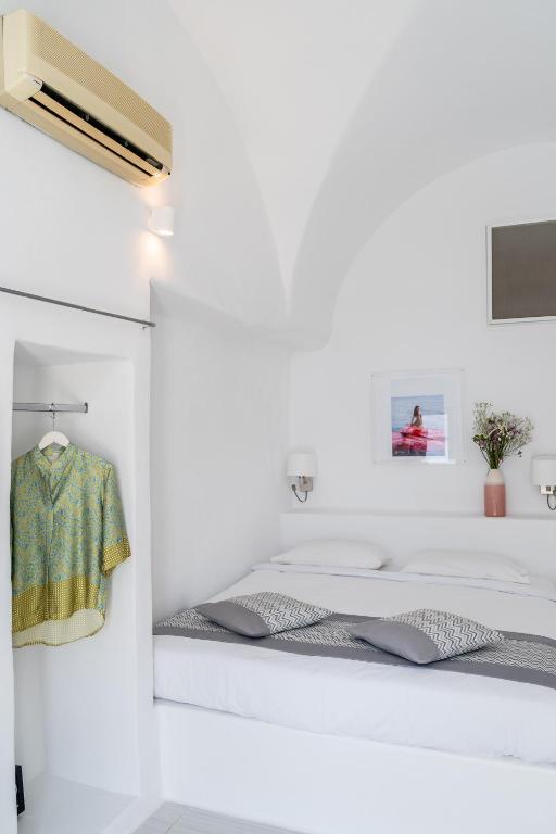 Postel nebo postele na pokoji v ubytování Vogue Suites