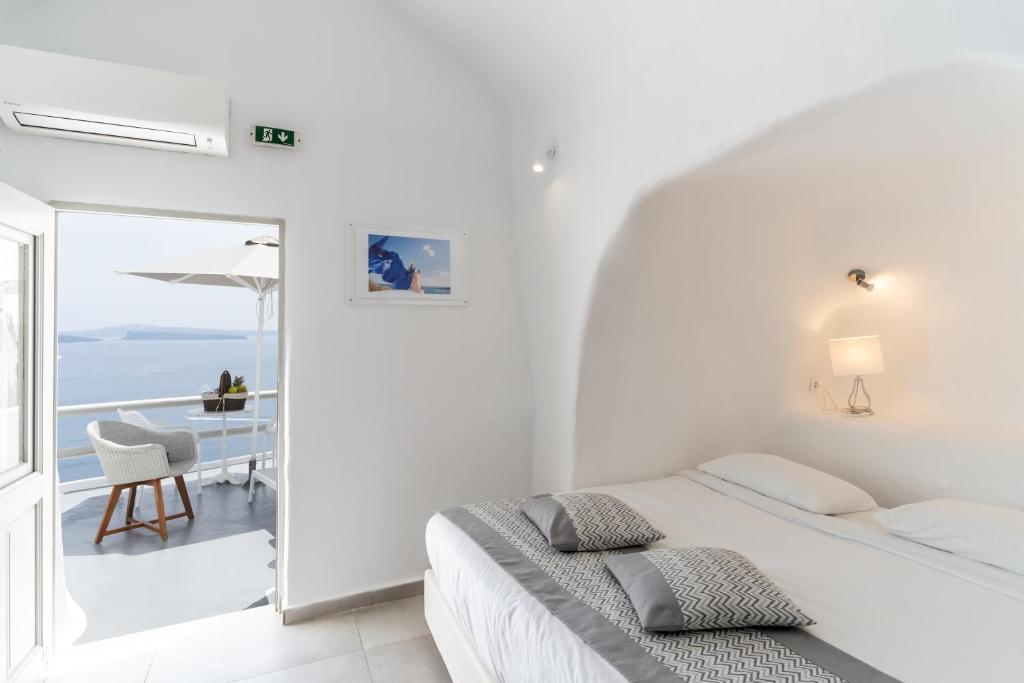 Postel nebo postele na pokoji v ubytování Vogue Suites