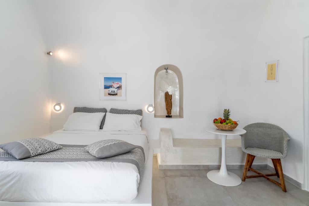 Postel nebo postele na pokoji v ubytování Vogue Suites