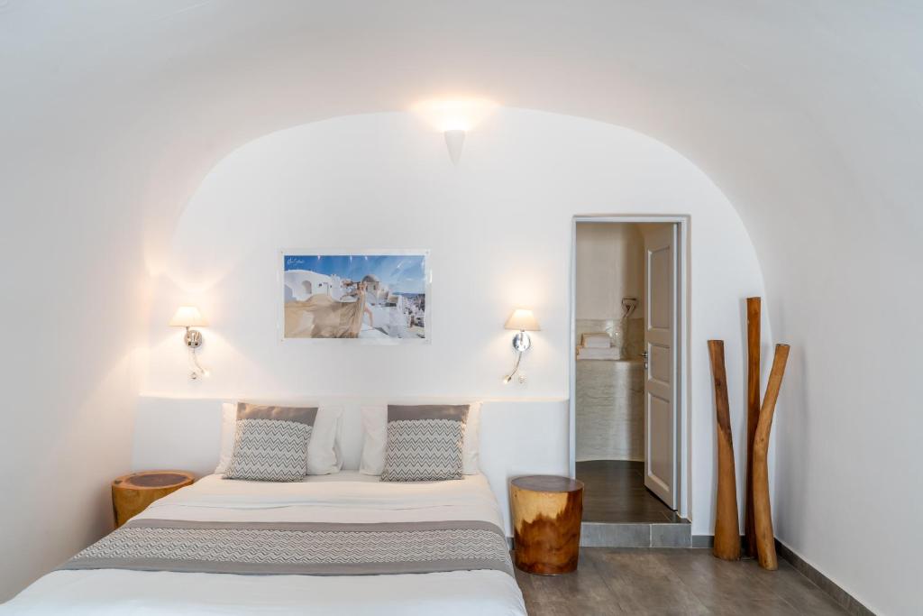 Postel nebo postele na pokoji v ubytování Vogue Suites