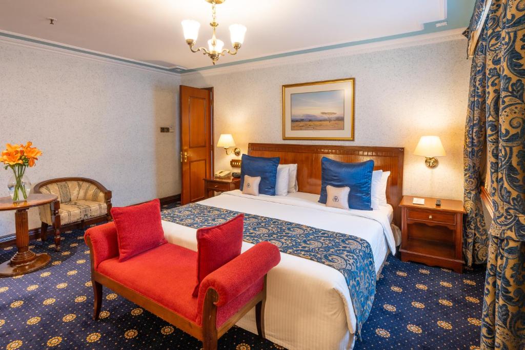 Postel nebo postele na pokoji v ubytování Sarova Stanley