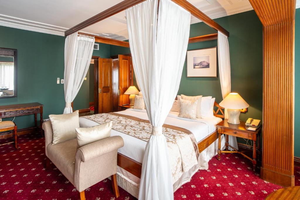 Postel nebo postele na pokoji v ubytování Sarova Stanley