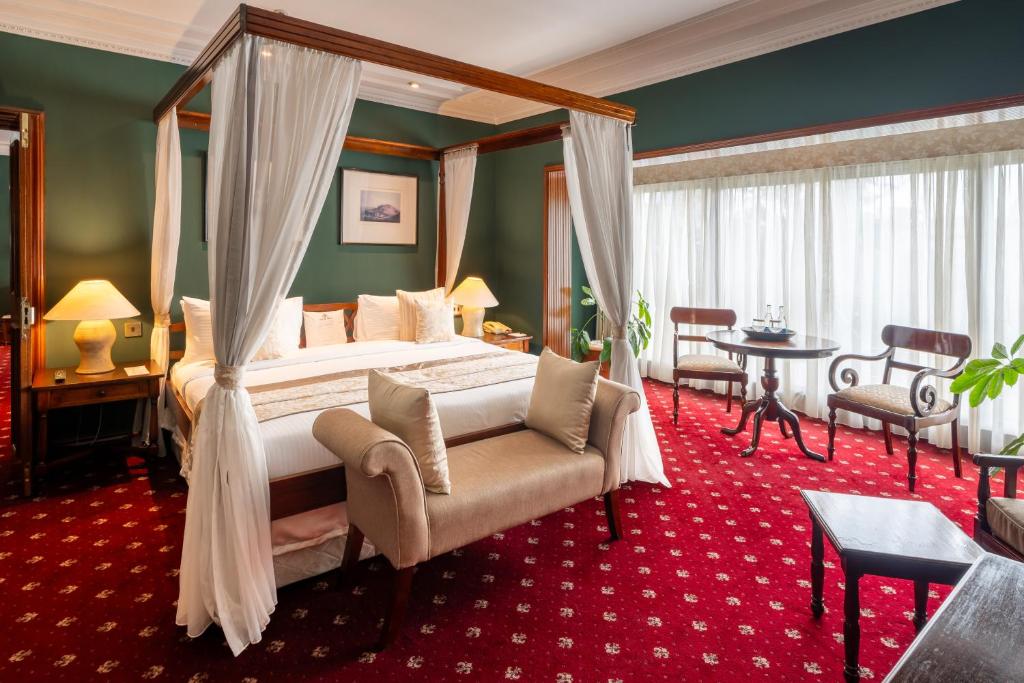 Postel nebo postele na pokoji v ubytování Sarova Stanley