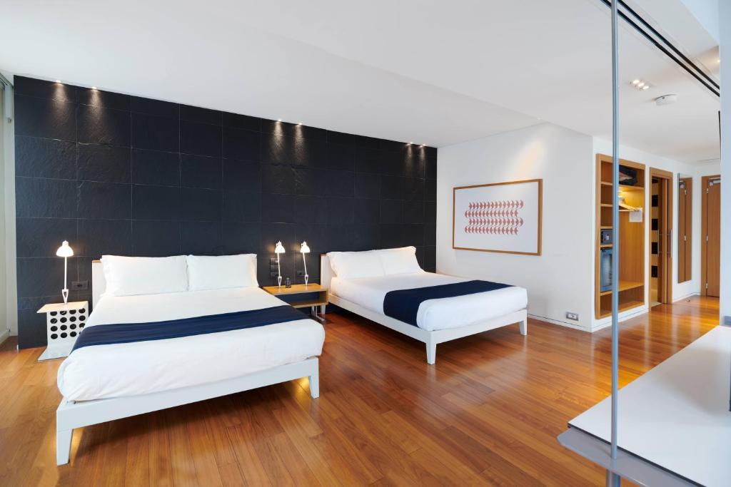 Postel nebo postele na pokoji v ubytování Hotel Plaza