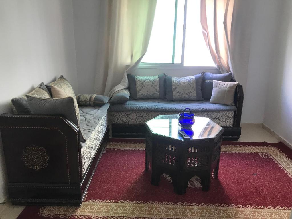 Ruang duduk di Appartement Familial Proche Aeroport Bab Andalous Tanger