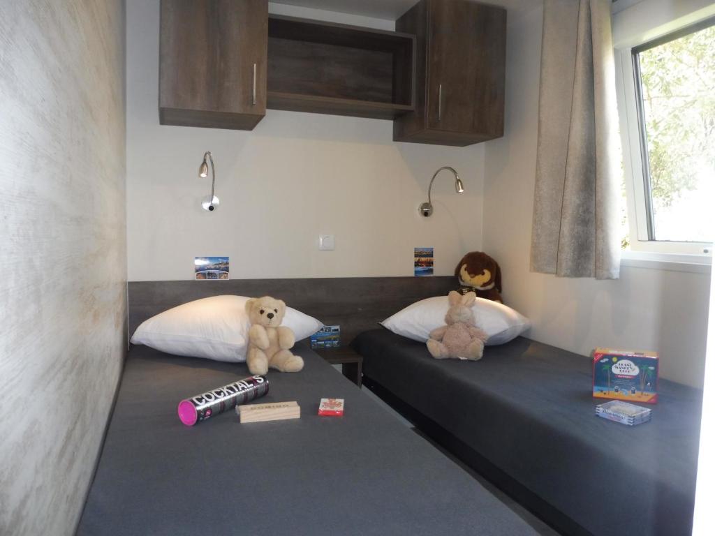 Postel nebo postele na pokoji v ubytování Camping de Trezulien