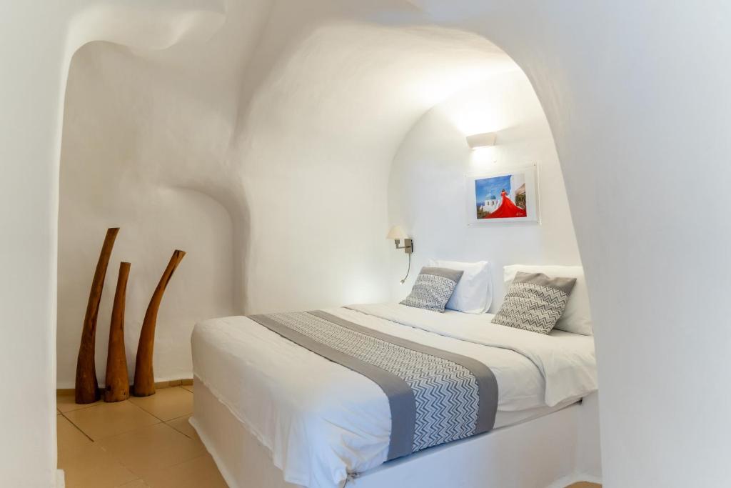 Postel nebo postele na pokoji v ubytování Vogue Suites
