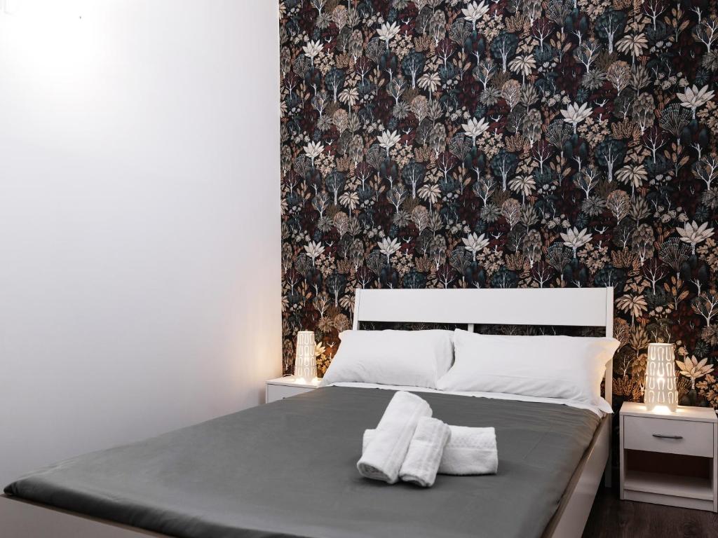Łóżko lub łóżka w pokoju w obiekcie B&B Università