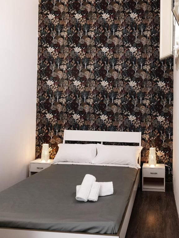 Łóżko lub łóżka w pokoju w obiekcie B&B Università