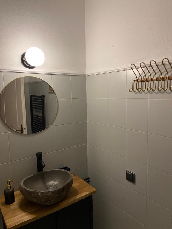 a bathroom with a sink and a mirror at Lulani Hideaway by Air Vitesse in Áyios Pandeleḯmon