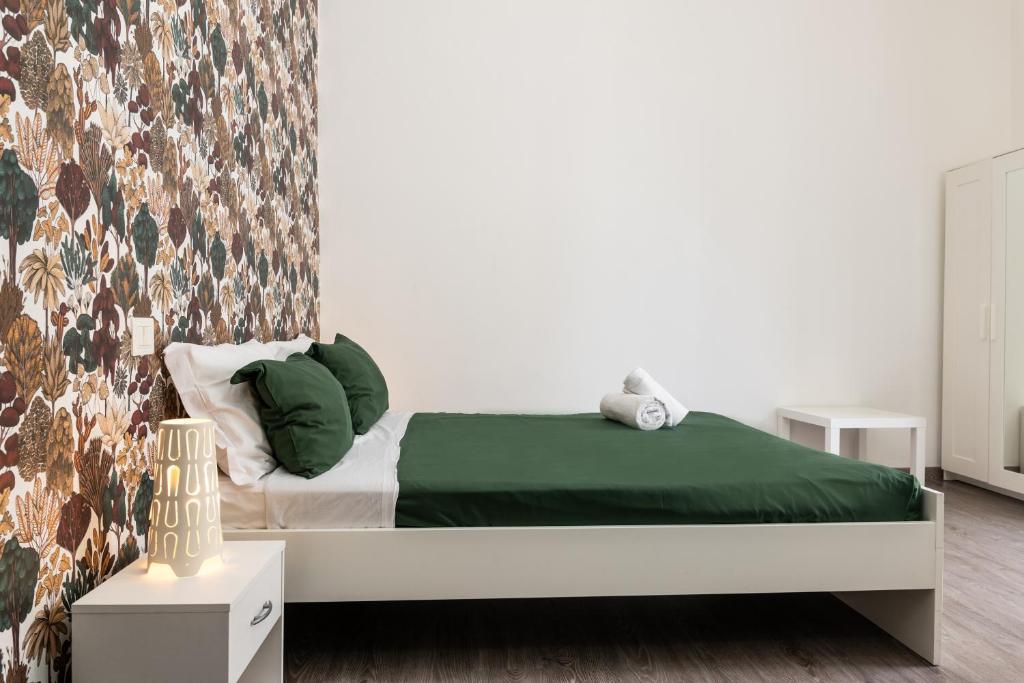 Łóżko lub łóżka w pokoju w obiekcie B&B Università