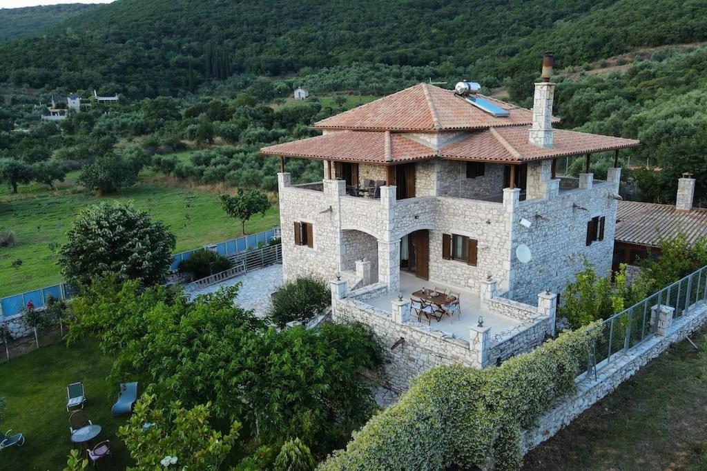 an aerial view of a house with a roof at Olive Stone Villa 