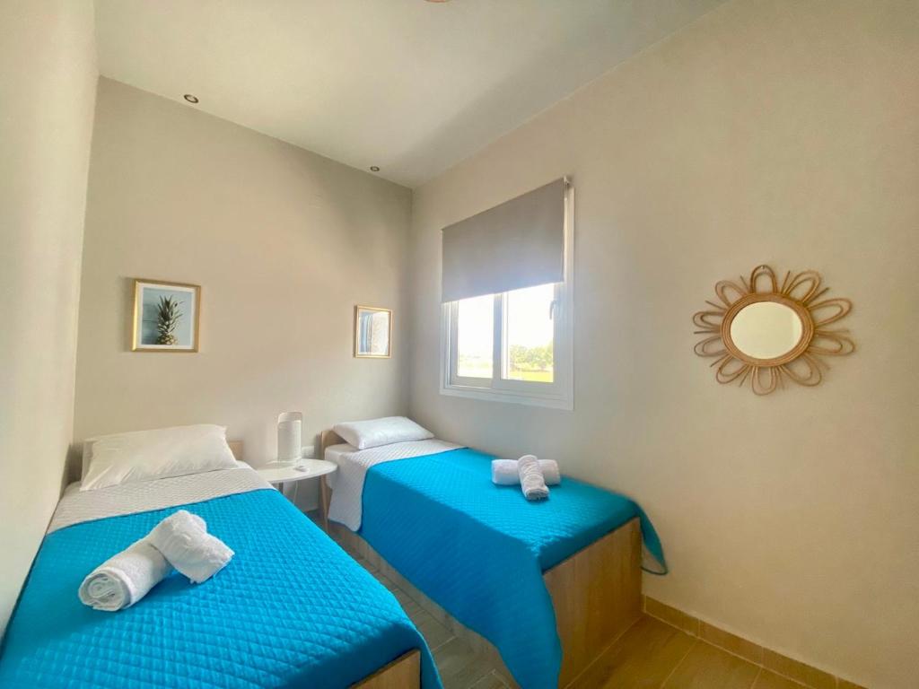 Posteľ alebo postele v izbe v ubytovaní Boho Natural Beachfront Detached House