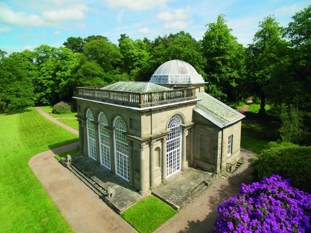 an aerial view of a building with purple flowers at Temple of Diana in Shifnal