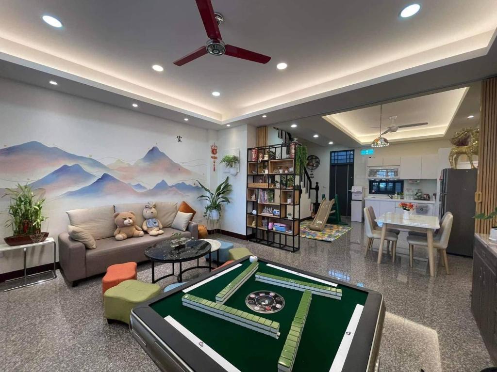 a living room with a pool table in the middle at Beauty Chen's House #2 in T'ien-wei