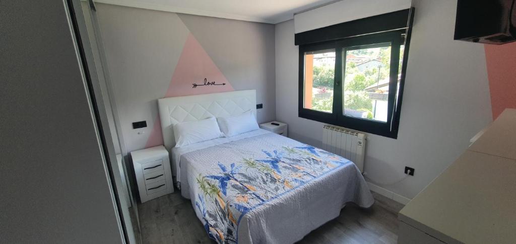 Кровать или кровати в номере Coqueto apartamento al lado de Cangas de Onis