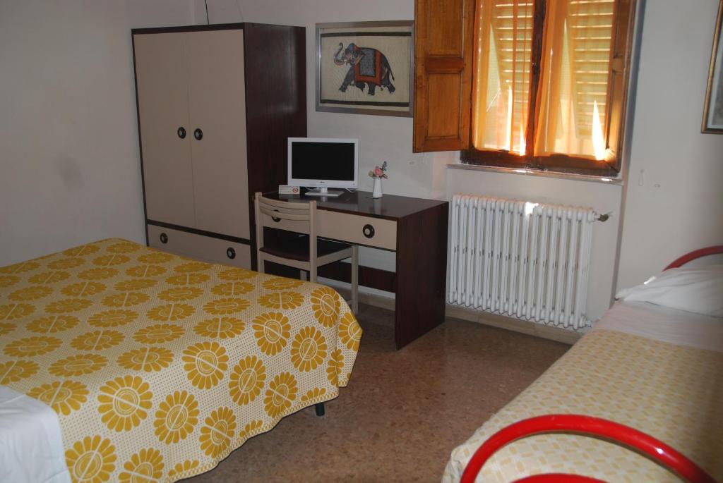Postel nebo postele na pokoji v ubytování Hotel Conchiglia