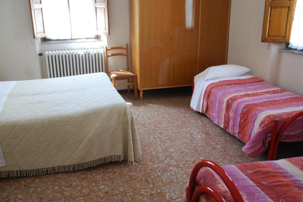 Postel nebo postele na pokoji v ubytování Hotel Conchiglia