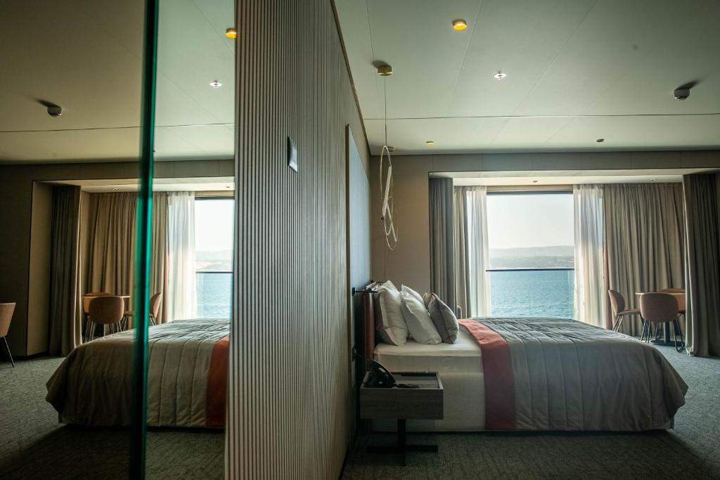 Postel nebo postele na pokoji v ubytování Hotel Medistone