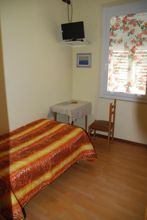Postel nebo postele na pokoji v ubytování Hotel Conchiglia