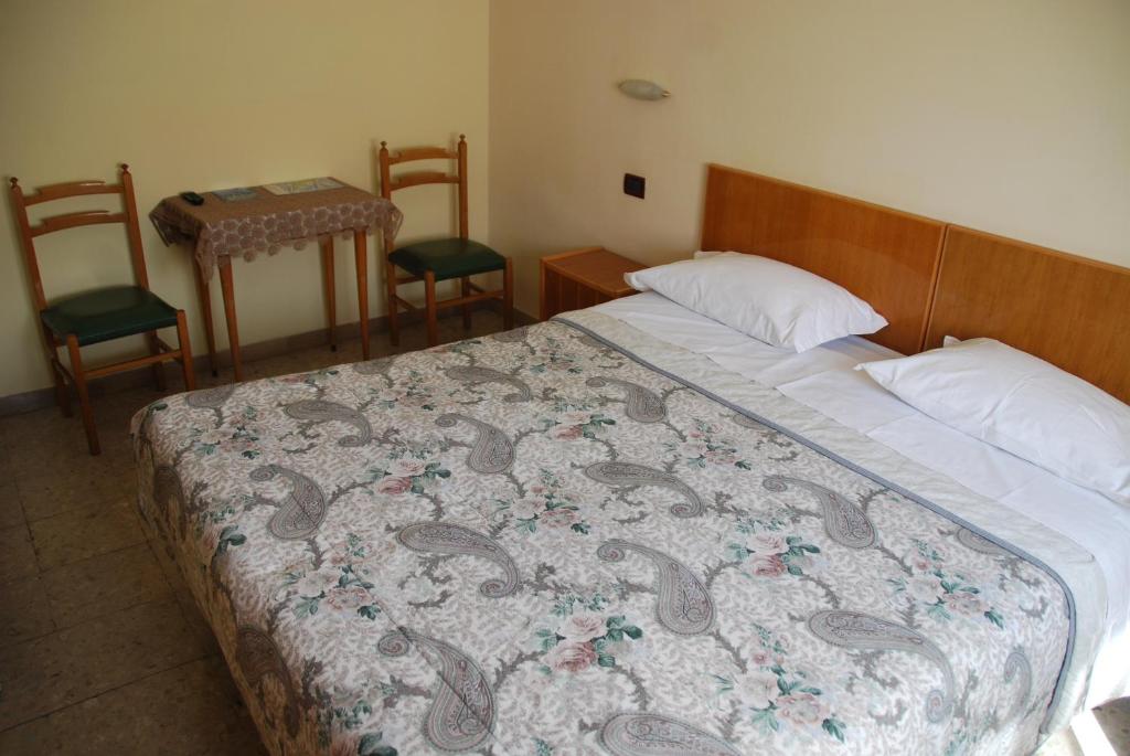 Postel nebo postele na pokoji v ubytování Hotel Conchiglia