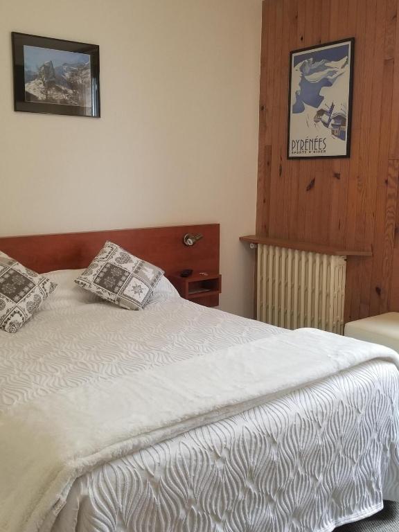 Postel nebo postele na pokoji v ubytování Hôtel L'Amoulat